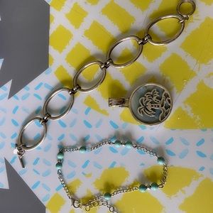 2 bracelets and charm